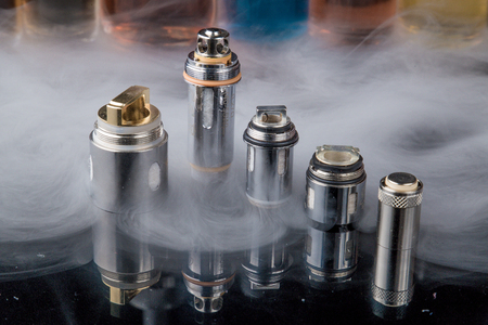 Electronic cigarette Clearomizer coils in smoke cloudの写真素材