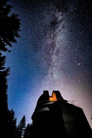 Milky way galaxy over observatoryの写真素材