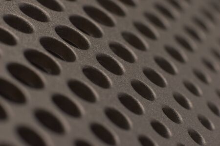 Abstract plastic holes in diagonal rows, close-up macro shotの写真素材