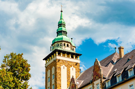 View on a historic palace in Lillafured, Hungary, Europe on a sunny day with a clear blue sky and clouds.のeditorial素材