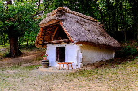 View of a classic old hungarian house in Cak, Hungary in a green environment on a sunny day.の写真素材