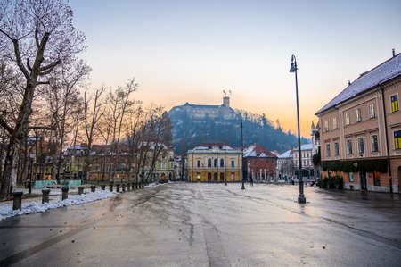 LJUBLJANA, SLOVENIA - FEBRUARY 15, 2022: Academia Philharmonic on Congress square and the castle in the backgroundのeditorial素材