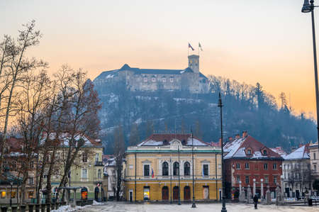 LJUBLJANA, SLOVENIA - FEBRUARY 15, 2022: Academia Philharmonic on Congress square and the castle in the backgroundのeditorial素材