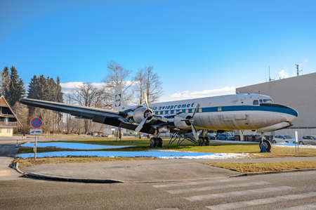 LJUBLJANA, SLOVENIA - FEBRUARY 15, 2022: Douglas DC-6B YU-AFF airplane next to the Ljubljana airport
