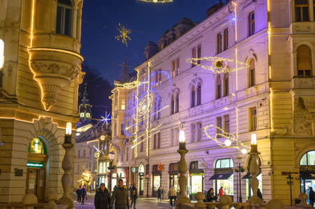 LJUBLJANA, SLOVENIA - JANUARY 01, 2022: Streets of Ljubljana during Christmas holiday with ornaments and festive lights at nightのeditorial素材