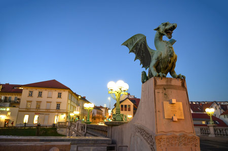 LJUBLJANA, SLOVENIA - FEBRUARY 15, 2022: View on the Famous Dragon bridge and the Dragon statue Zmajski now the symbol of Ljubljana, capital of Slovenia, Europe.のeditorial素材