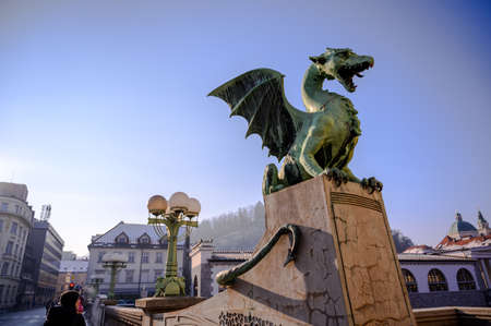 LJUBLJANA, SLOVENIA - FEBRUARY 15, 2022: View on the Famous Dragon bridge and the Dragon statue Zmajski now the symbol of Ljubljana, capital of Slovenia, Europe.のeditorial素材