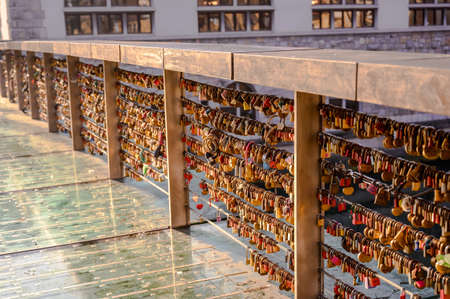 LJUBLJANA, SLOVENIA - FEBRUARY 15, 2022: Love locks on the bridge in Ljubljana, Slovenia