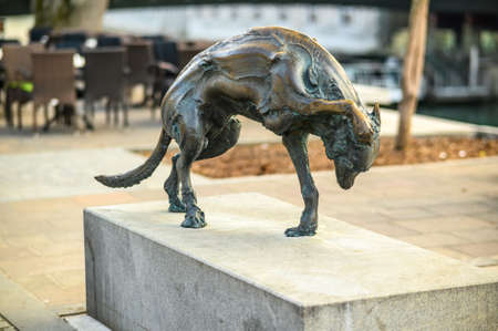 LJUBLJANA, SLOVENIA - FEBRUARY 15, 2022: Modern statue of dog by Jakov Brdar on Butcher Bridgeのeditorial素材
