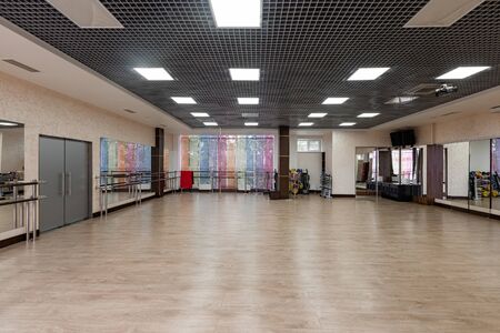 large and light hall with mirrors, music, equipment for dancing, sports. Group fitness room. Modern...