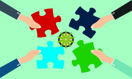 Business team with pieces of puzzle in office