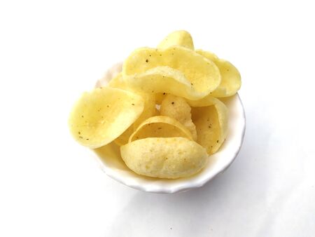 yellow eating snacks food for children in white bowlの写真素材