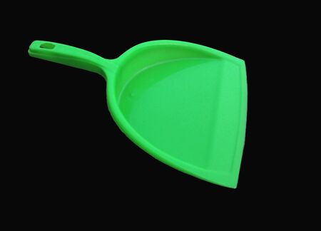 green garbage cleaner isolated on black backgroundの写真素材