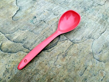 mage of big spoon on stone backgroundの写真素材