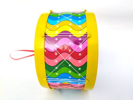 multi color children playing drum isolated on white backgroundの写真素材