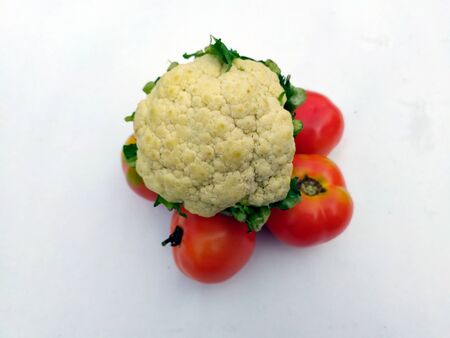 many fresh healthy vegetable put in a plastic boul isolated on white backgroundの写真素材