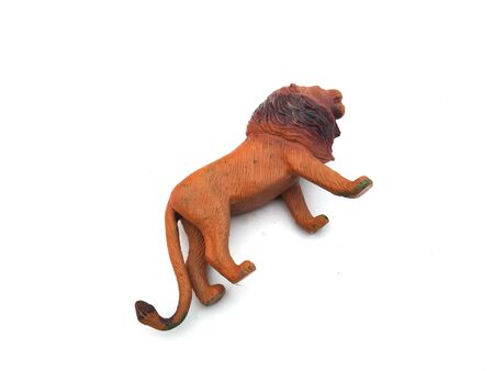 a plastic lion toy isolated on white backgroundの写真素材