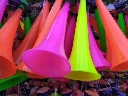 some multi color plastic horn put on a toy shop