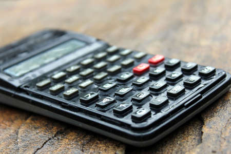 a wet scientific calculator  isolated on stone background