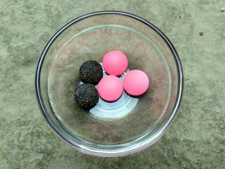 some medicine tablets put in a glass bowl