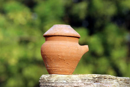red clay pot put on a stoneの写真素材