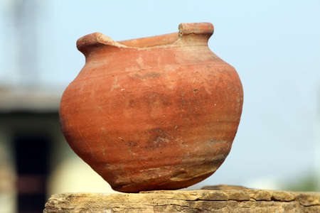 red clay pot put on a stone