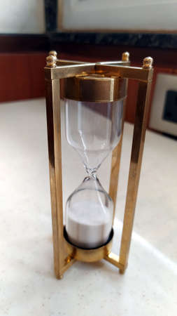 hourglass (or sandglass, sand timer, sand clock or egg timer) is a device used to measure the...