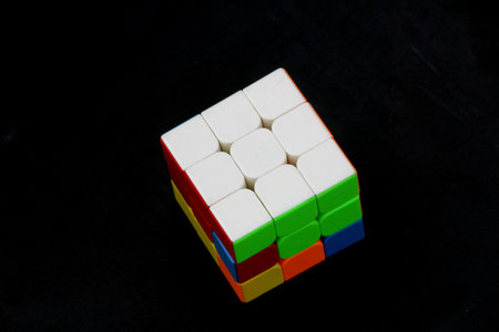 Plastic building blocks on a black background, closeup of photo