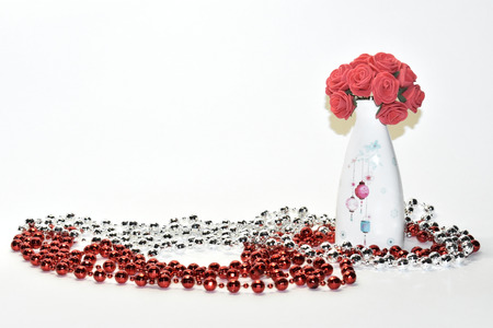 Vase with flowers and jewelryの写真素材