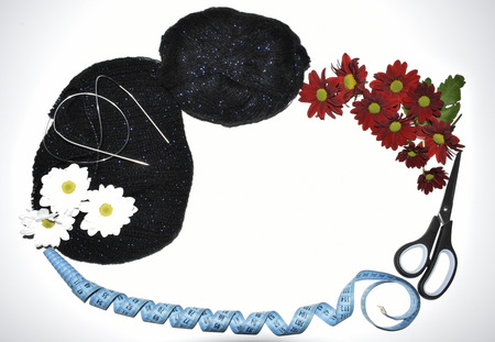 Isolated on a white background are knitted things, knitting needles, centimeter, scissors and flowers.の写真素材