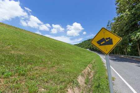 Rural road with green grassの写真素材