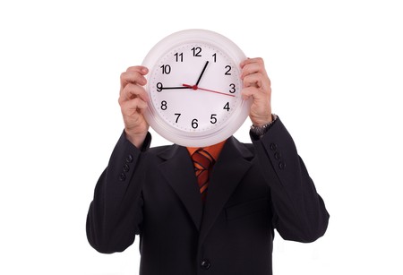 Man holds a clockの写真素材