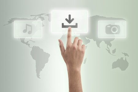 The hand presses download buttonの写真素材