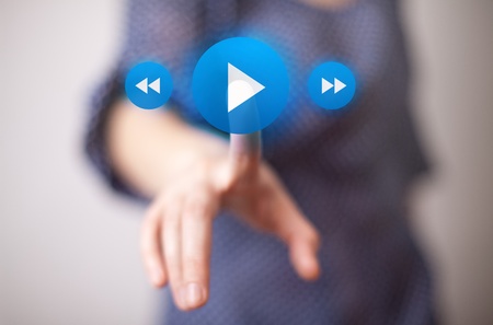 woman hand pressing Play button