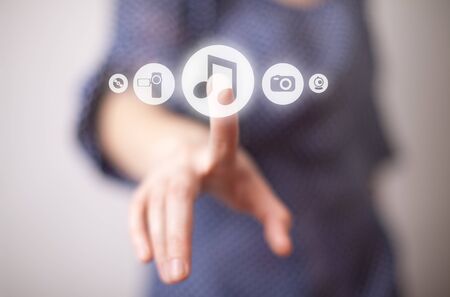 woman hand pressing Play button