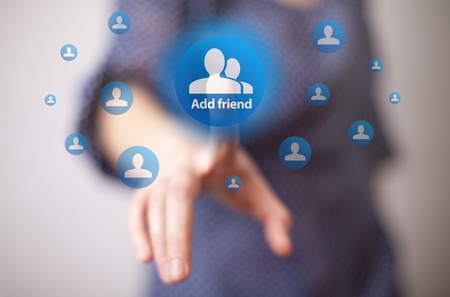 woman hand pressing add friend buttonの写真素材