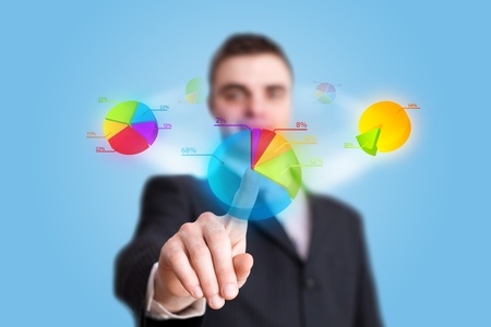businessman hand pressing pie chart buttonの写真素材