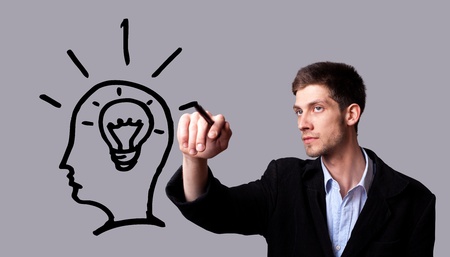 Businessman hand drawing and idea for making money on the whiteboard