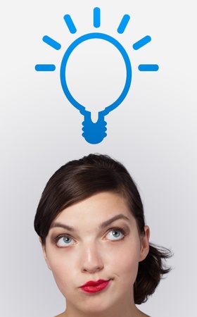 Young girl head looking with gesture at idea type of signの写真素材