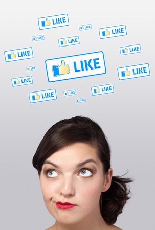 Young girl head looking with gesture at social type of icons and signsの写真素材