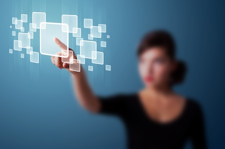 Businesswoman pressing high tech type of modern buttons on a virtual backgroundの写真素材