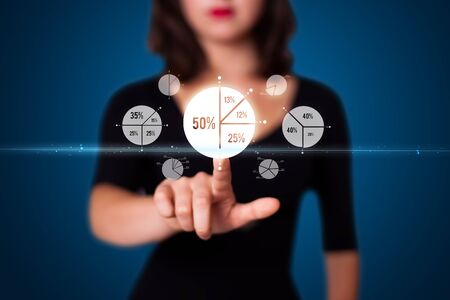 Businesswoman pressing business type of modern buttons with virtual backgroundの写真素材