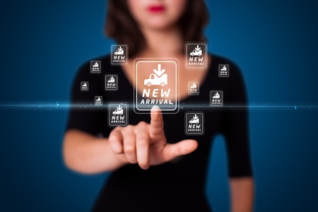 Businesswoman pressing promotion and shipping type of modern buttonsの写真素材