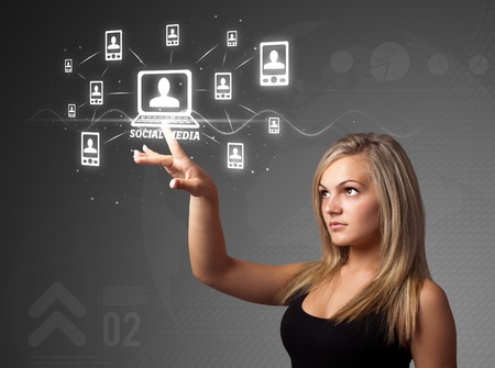 Businesswoman pressing modern social buttons on a virtual backgroundの写真素材