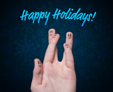Happy group of finger smileys with holidays sign on blue backgroundの写真素材