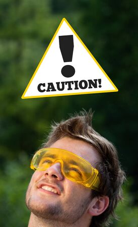 Young persons head looking at construction signsの写真素材