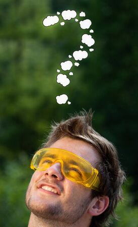 Young persons head looking with gesture at writing marks