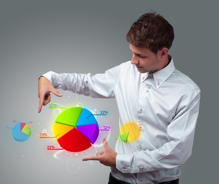 Young businessman holding virtual business signの写真素材