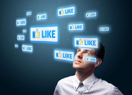 Businessman pressing modern social buttons on a virtual background