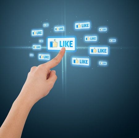 Businessman pressing modern social buttons on a virtual background